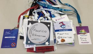 A pile of the name tags Mauricio has amassed from the camps he's visited.