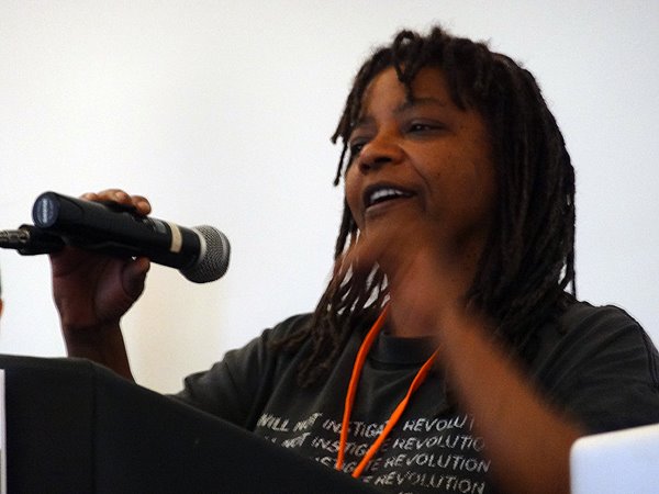 Micky Metts speaking at event