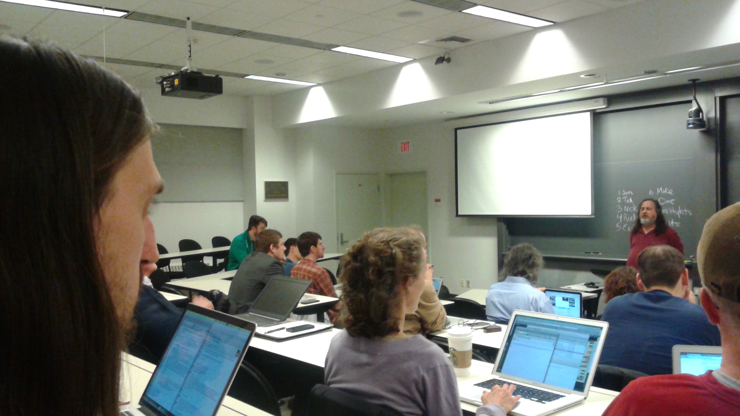 Richard Stallman speaks to room of people.