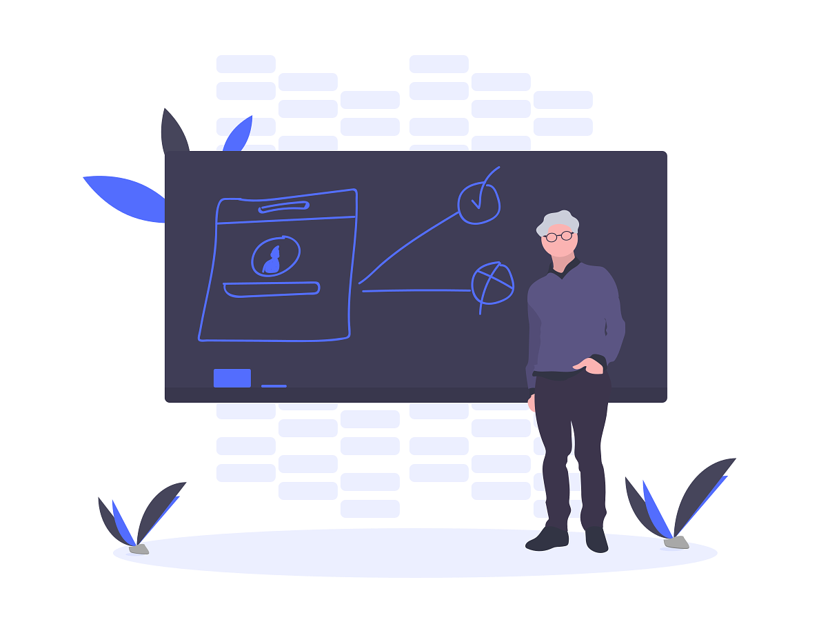 A teacher standing in front of a blackboard.